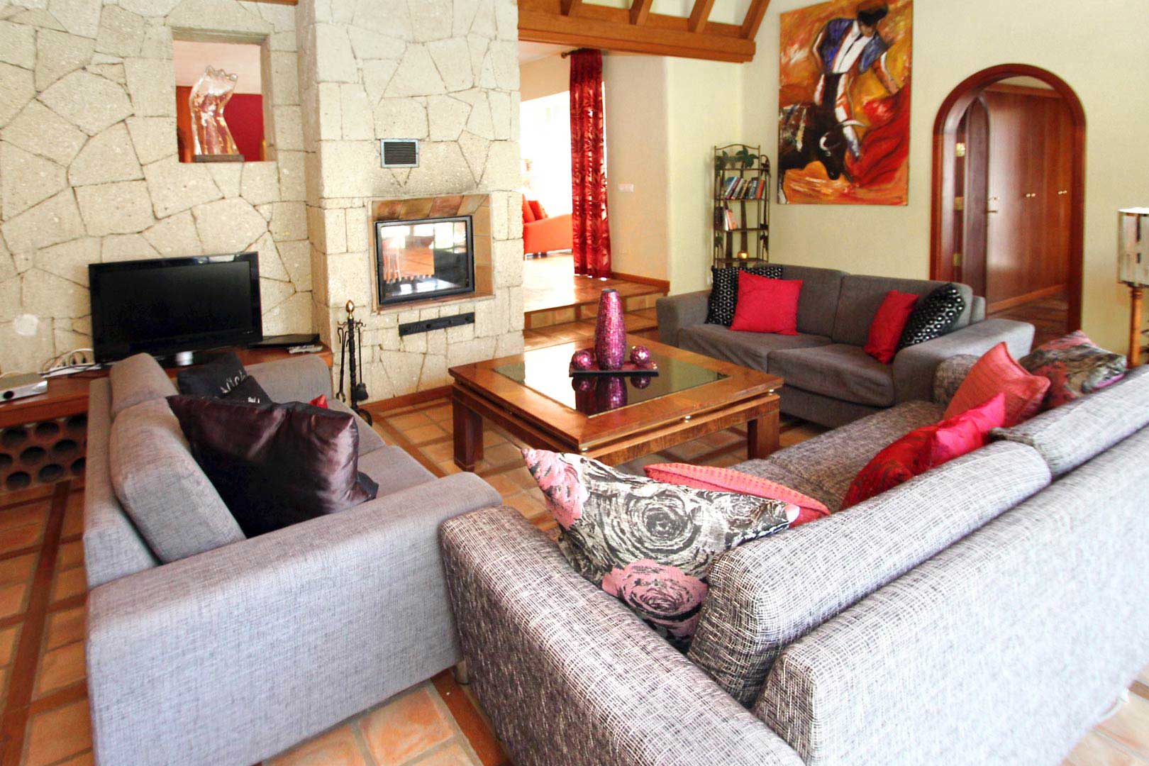 Large living room with sofas and fire place on ground floor