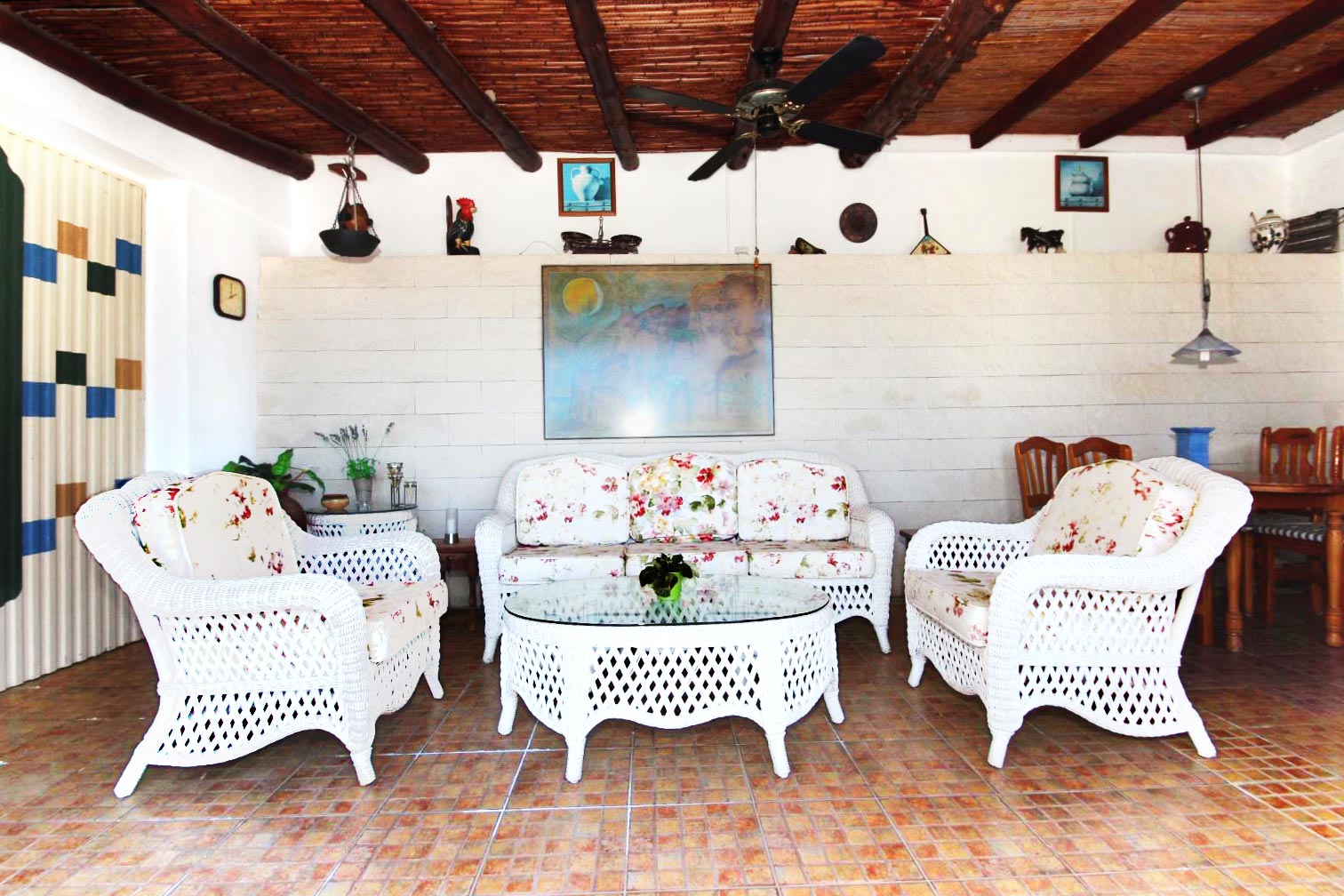 The terrace features also comfortable outdoor furniture.