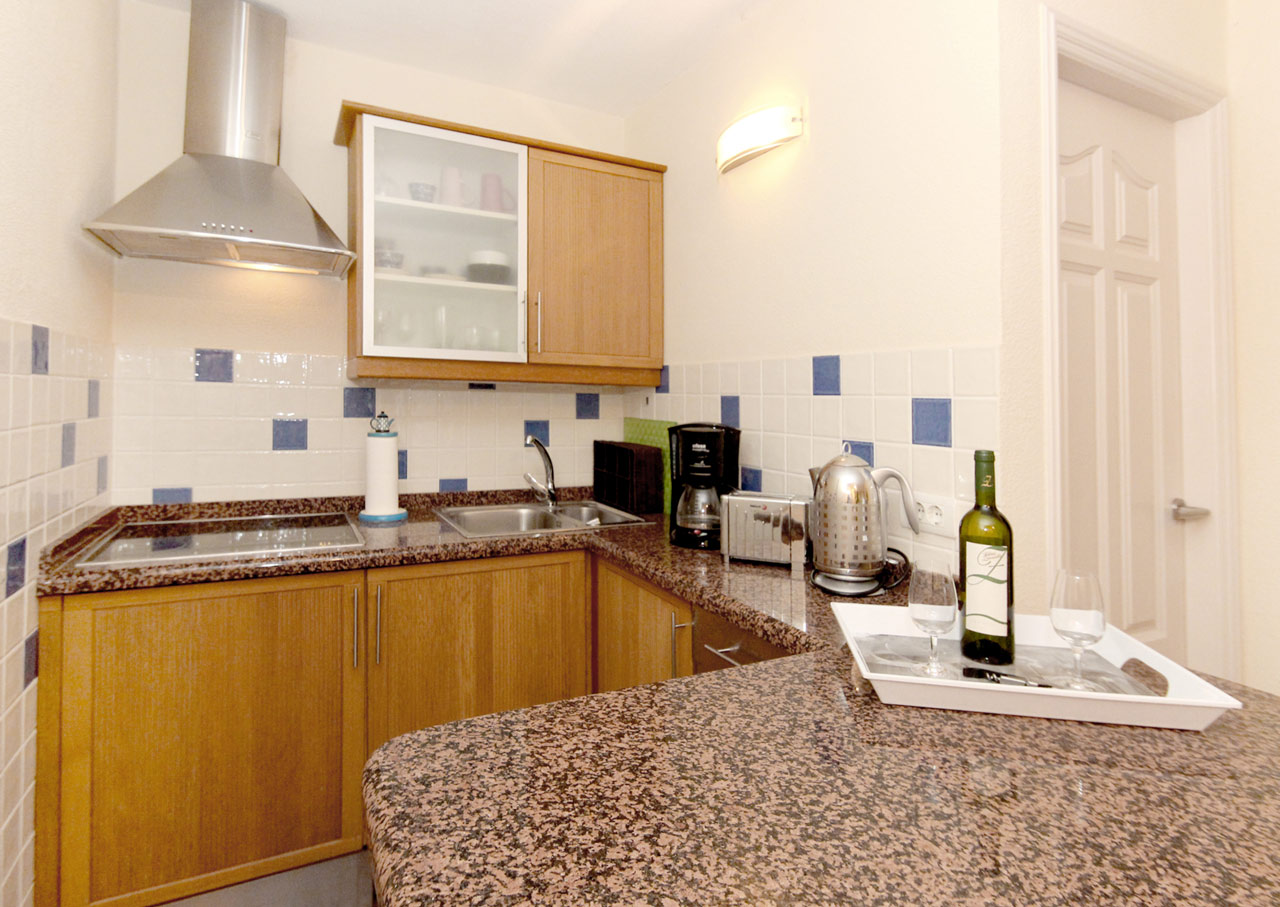 A kitchenette is integrated in the living room.
